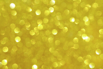 Golden glittering bokeh background, abstract christmas texture, copy space.