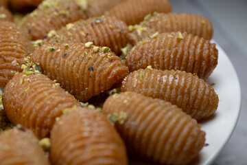 Lebanese recipe for Maakaroun fritters: fine wheat semolina, flour, butter, oil, ground anise. High quality photo