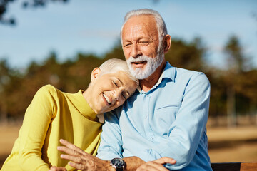 Happy active senior couple having fun outdoors