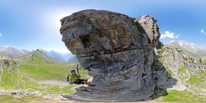 360 VR climber suspended above Alagna Valsesia on Via Ferrata Cimalegna, Italian Alps