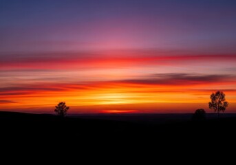 Naklejka premium The breathtaking beauty of the evening sky at sunset during the golden hour provides a captivating silhouette of the peaceful natural landscape, sky, yellow, golden hour