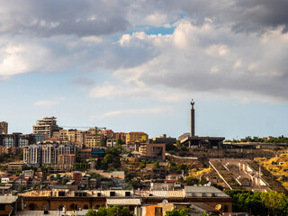 cloudy sky over Cascade and houses in Yerevan city