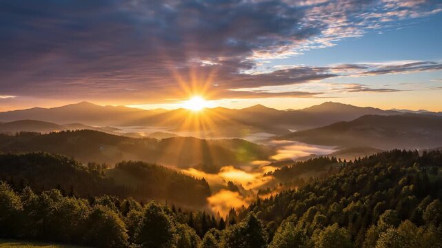 Serene sunset landscape with fog rolling in over distant mountains captures the essence of a peaceful retreat or escape from daily life, perfect for commercial uses such as backgrounds or.
