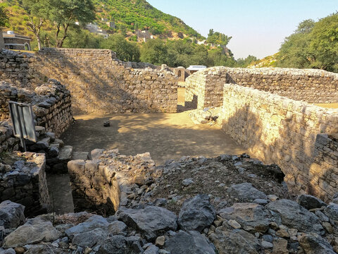 Heritage Buddhist monastery kitchen and stone well showing daily life at Mohra Muradu Taxila Pakistan