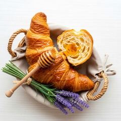 Croissant with honey, dipper in a basket on wooden table, flat lay on a white background