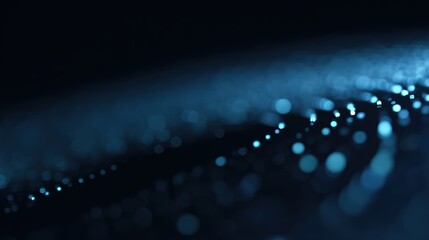 Abstract digital circular pattern of luminous blue dots on dark background, futuristic data visualization design