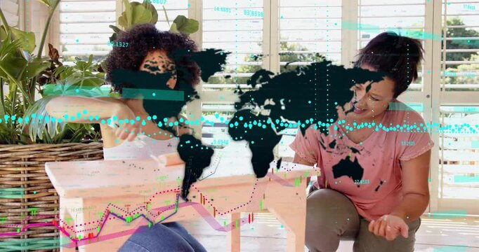 Two women painting bench on porch, roller motion causing map and financial charts overlaying box
