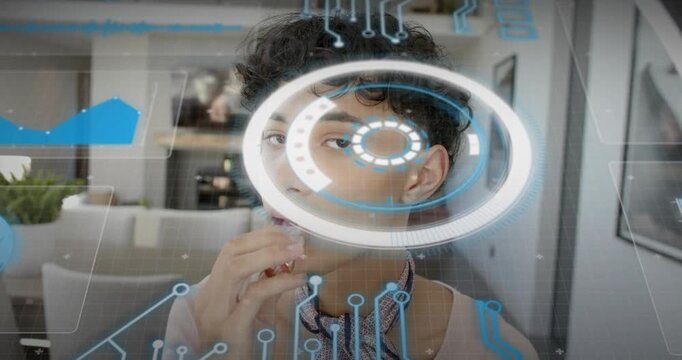 Man bringing hand to lips, applying lip product for beauty demo, while AR HUD scanning face