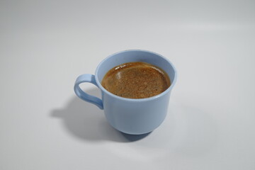 A cup of americano coffee on a white background, top view