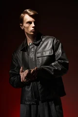 Fotobehang Beren Captivating young man embodies modern masculinity in stylish dark attire  © LIGHTFIELD STUDIOS