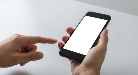 Hand holding smartphone with blank white screen while another finger points toward the touchscreen display, offering copy space.
