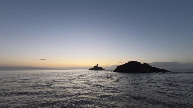 4K video of daybreak over the Mumbles Lighthouse in West Glamorgan, Wales