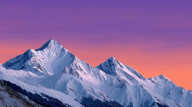 Stunning view of snow-covered mountains under a colorful sunset sky, evoking tranquility and awe in nature.