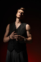 Embodying modern masculinity with confidence and allure in a dramatic lighting setup