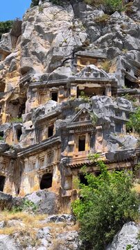 Rock-cut tombs of the ancient Lycian necropolis. Myra is an antique town in Lycia where the small town of Kale (Demre) Turkey. Close-up of rock cut tomb grave. 