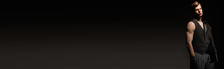 Naklejka premium Modern masculinity shines through a young mans confident pose in a stylish setting