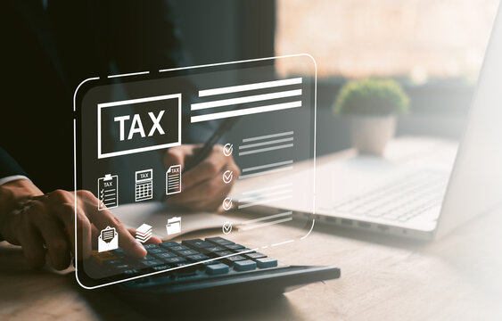 Close-up of hand using calculator with digital tax checklist interface, suitable for financial reports, income tax return, tax preparation, and online accounting services.