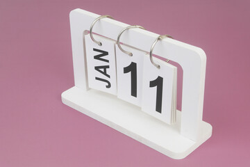 January, 11 on calendar on purple background.