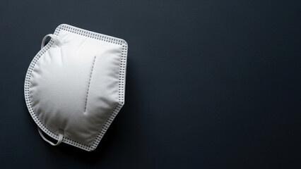 Protective Face Mask on Dark Background.