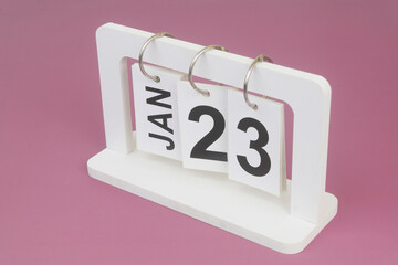 January, 23 on calendar on purple background.
