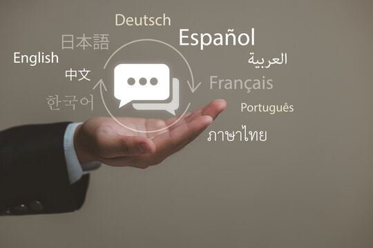 Diverse Languages and Communication Symbols Represented in a Hand, Showcasing Global Interaction in a Professional Setting