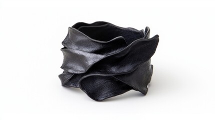 Black, abstract sculpture of overlapping petals.
