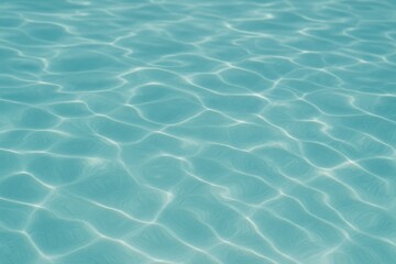 Fototapeta premium Calm turquoise water surface with gentle wave patterns reflecting sunlight. Concept of tranquility, relaxation, and natural beauty in aquatic environments.