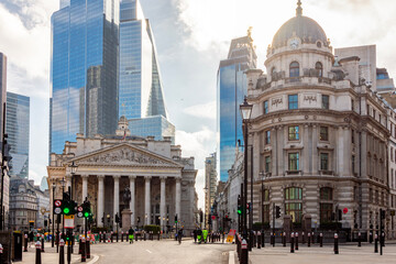 Royal Exchange building and skyscrapers in City of London, UK