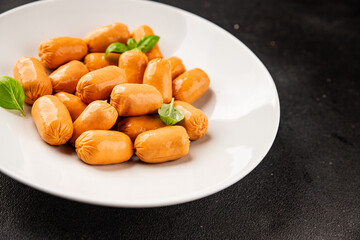 Sausage mini meat portion size fast food natural product tasty snack fresh delicious gourmet food background on table rustic top view copy space