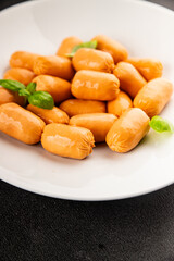 Sausage mini meat portion size fast food natural product tasty snack fresh delicious gourmet food background on table rustic top view copy space