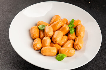 Sausage mini meat portion size fast food natural product tasty snack fresh delicious gourmet food background on table rustic top view copy space