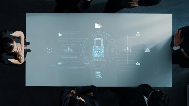A diverse group of professionals engages in a business meeting, featuring digital security concepts projected on a modern table, highlighting data protection and collaboration. Raster - Powered by Adobe