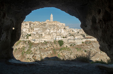 Panoramic view of ancient town of Matera from cave in park Murgia Materana, Basilicata, southern Italy