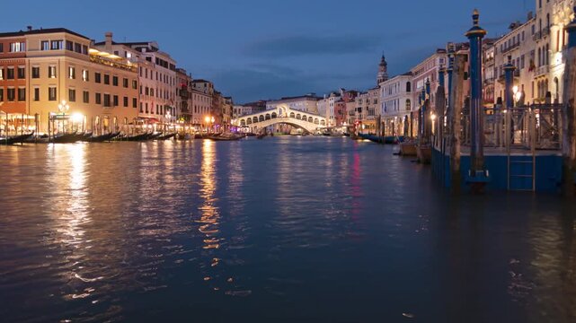 Day to night transition hyper lapse Grand Canal traffic and Rialto Bridge, Venice, Italy