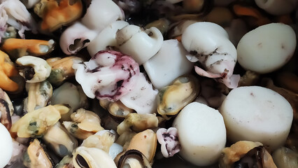 A fresh seafood platter with shrimp, mussels, and oysters. The scene conveys freshness, culinary delight, and coastal flavors.