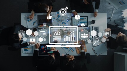 A captivating overhead view of a business meeting featuring professionals analyzing data, with digital marketing graphics highlighting crucial insights and strategies. Raster