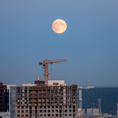 moonrise over industrial area evning