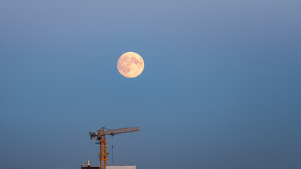 moonrise over industrial area evning