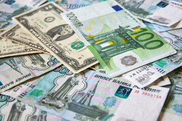 background of paper bills dollars, euros and rubles. Currency exchange rate