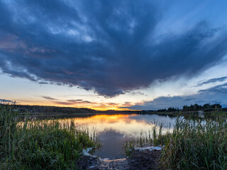 Beautiful sunset over a lake with a cloudy sky