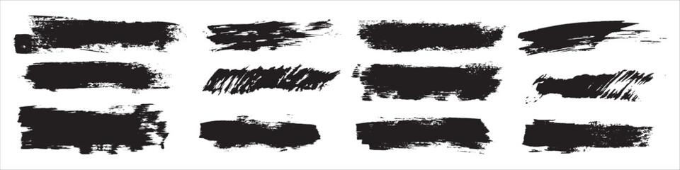 Set of black grunge brush strokes and ink splatters for distressed design elements