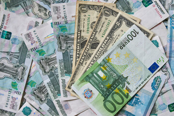 background of paper bills dollars, euros and rubles. Currency exchange rate