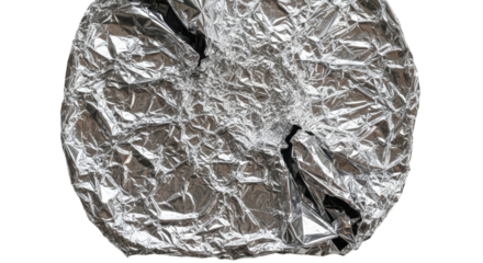 Crushed crumpled shiny silver aluminum foil texture with dark brown organic material inside isolated on transparent background