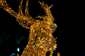 Illuminated deer sculpture with twinkling lights