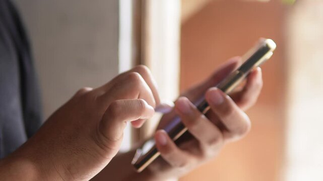 Someone typing on a smartphone screen. Writing a message, comment, or browsing. Technology theme.