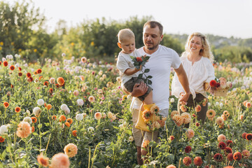Family enjoying time together in dahlia garden