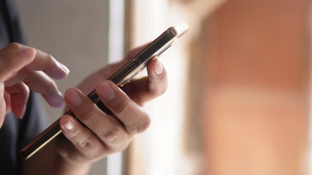 Someone typing on a smartphone screen. Writing a message, comment, or browsing. Technology theme.