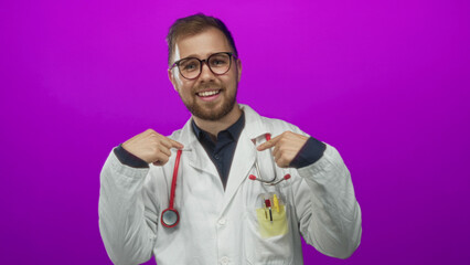 Obraz premium Man doctor points finger to chest wearing lab coat and glasses with stethoscope in magenta studio; confidence care.