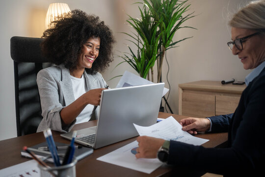 Woman consulting with a female financial manager at the bank