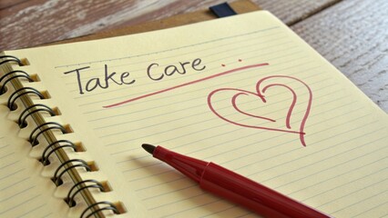 Notebook page with handwritten message and heart drawing